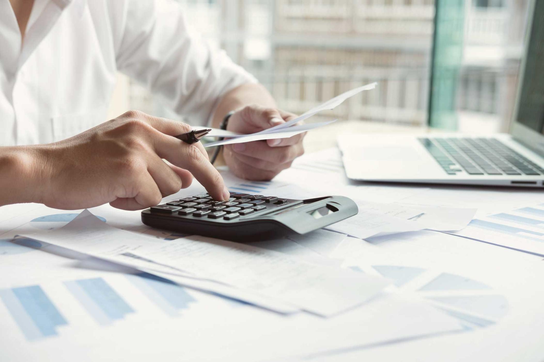 Business owner calculating taxes.