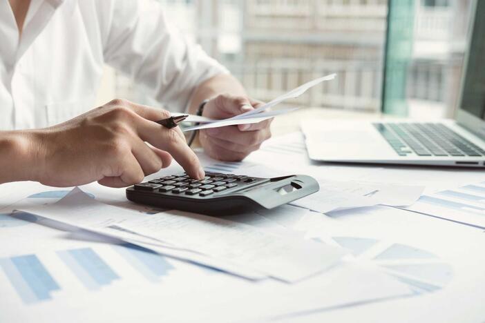 Business owner calculating taxes.